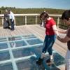Wayne helping Kate onto the glass tiles.  We know the glass will hold, but its 210 feet down....